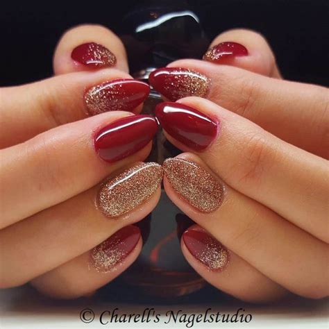 dark red nails with gold glitter